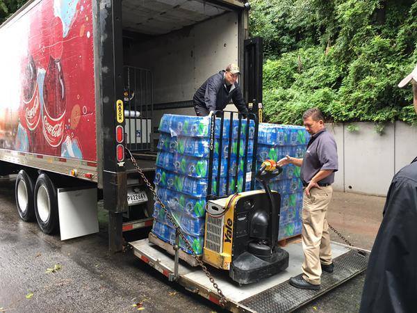 Coca-Cola Bottling Co. Consolidated Provides Drinking Water Bottles To The Flood Victims