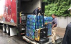 Coca-Cola Bottling Co. Consolidated Provides Drinking Water Bottles To The Flood Victims